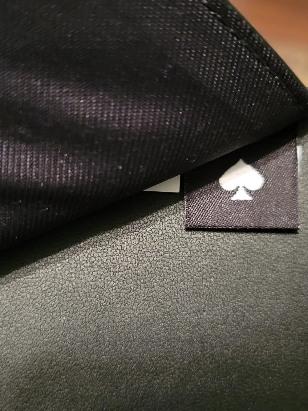 kate spade black saffiano passport wallet with gold logo